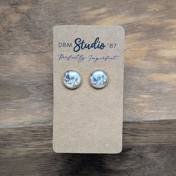 small round glass cabochon earrings in gold tone. An image of a cartoon steampunk octopus holding a coffee inside.